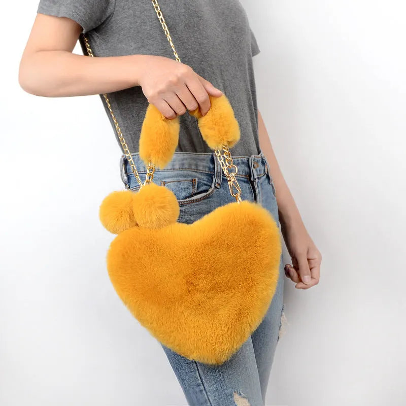 Heart-shaped soft plush women's handbag with zipper opening in medium size