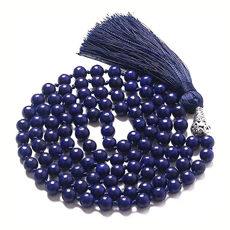 Long geometric agate tassel necklace with multi-coloured stones on a white background.