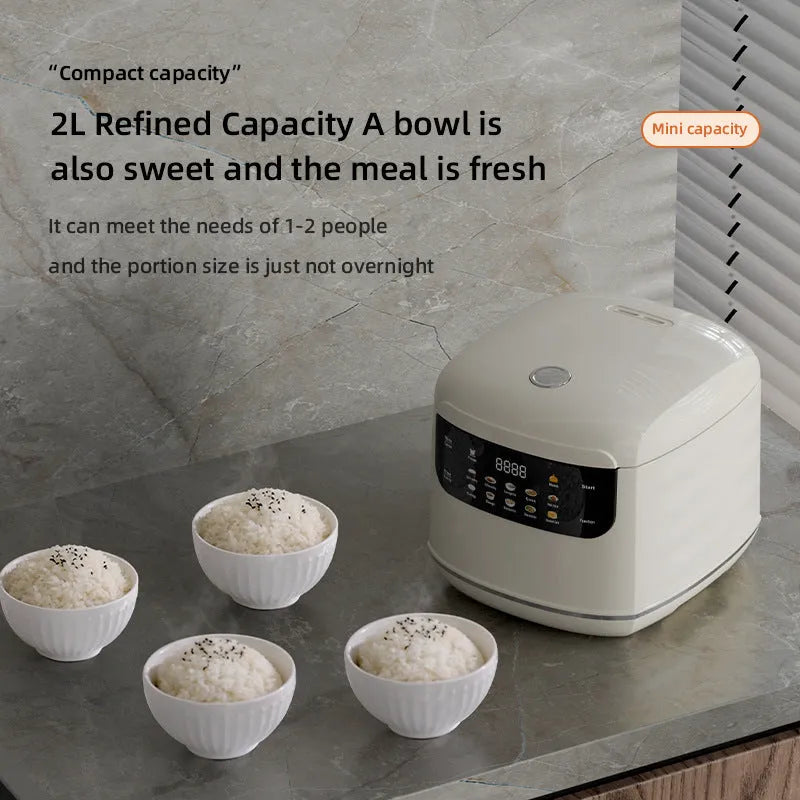 White 2L smart rice cooker with black microcrystal panel and PP steamer on kitchen counter