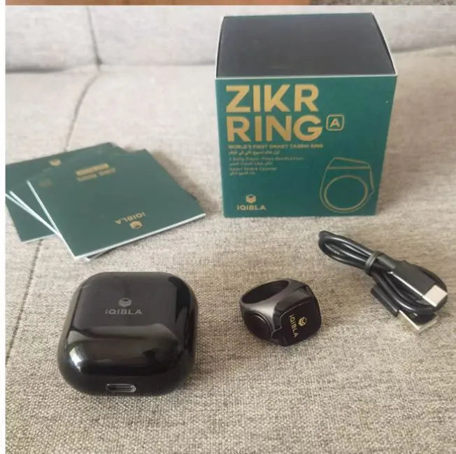 Zikr1 metal smart ring showing OLED display and button, in colours black, green, rose gold, and silver.
