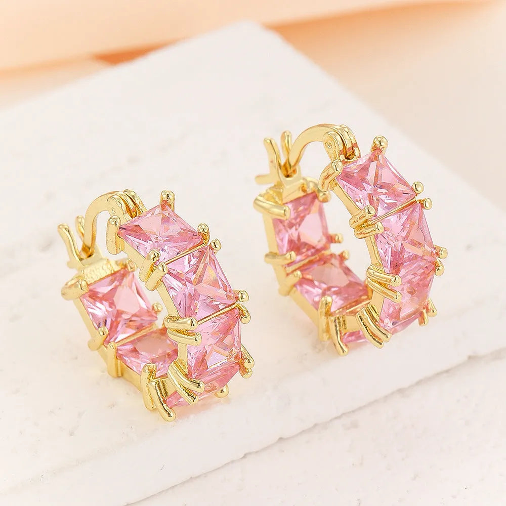 Geometric U-shaped copper earrings with round crystal zirconium accents in gold electroplated finish