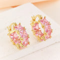Geometric U-shaped copper earrings with round crystal zirconium accents in gold electroplated finish