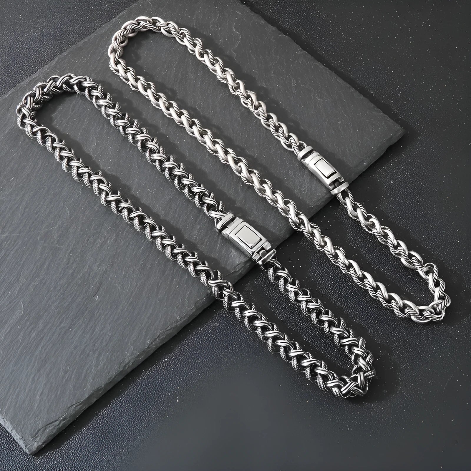 Men's keel twist titanium steel chain necklace in antique silver on a grey background