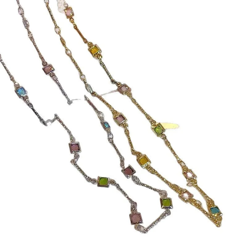 Square colour geometric alloy clavicle chain necklace with artificial crystal detail in gold tone.