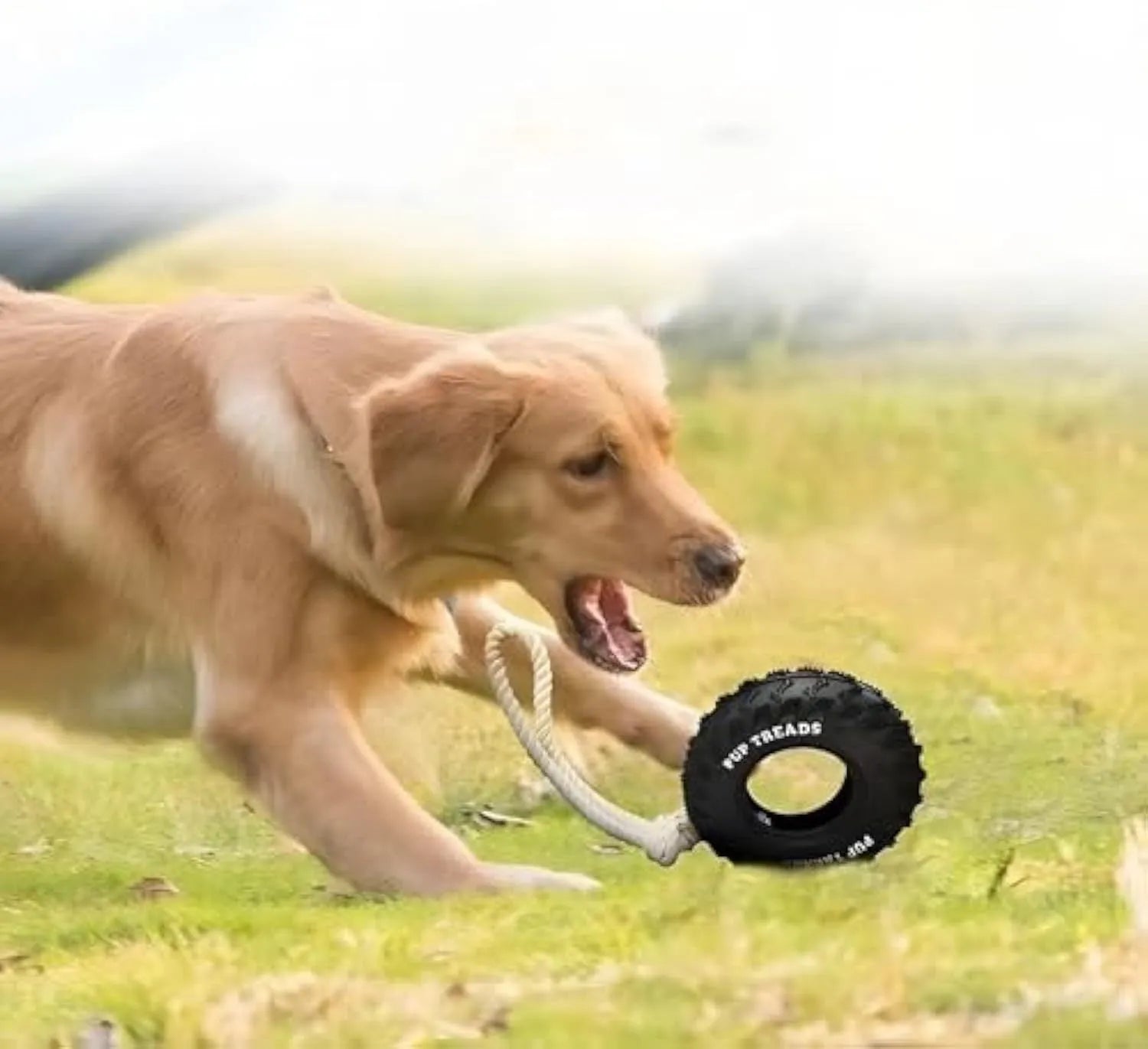 Black natural rubber tire dog toy with rope for aggressive chewers, large size 35x16 cm