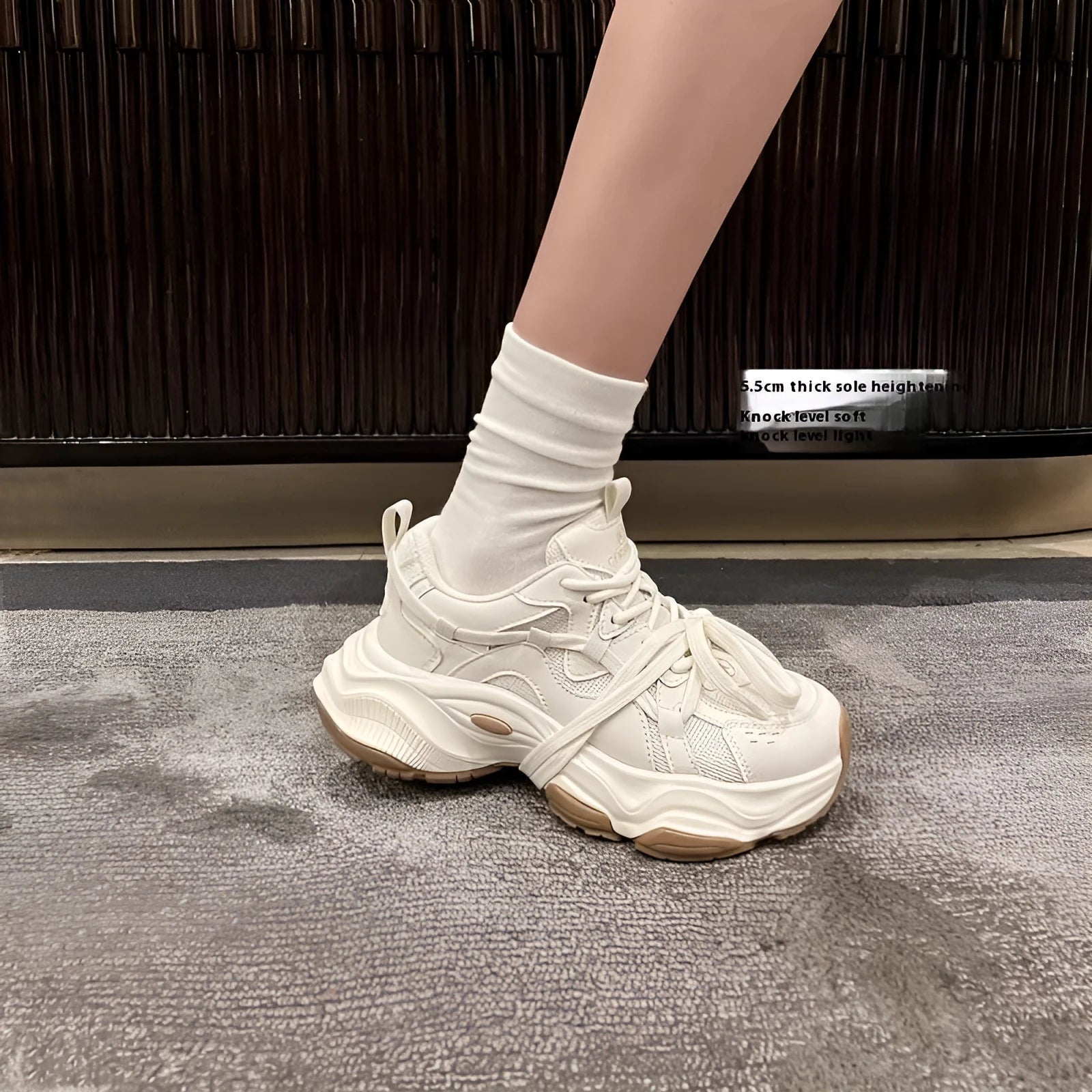 Women's beige platform running sneakers with round toe and lace-up design on white background
