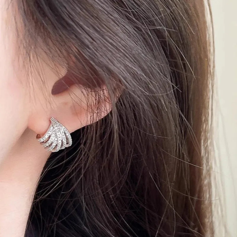 Geometric zircon earrings for women with a platinum electroplated finish.