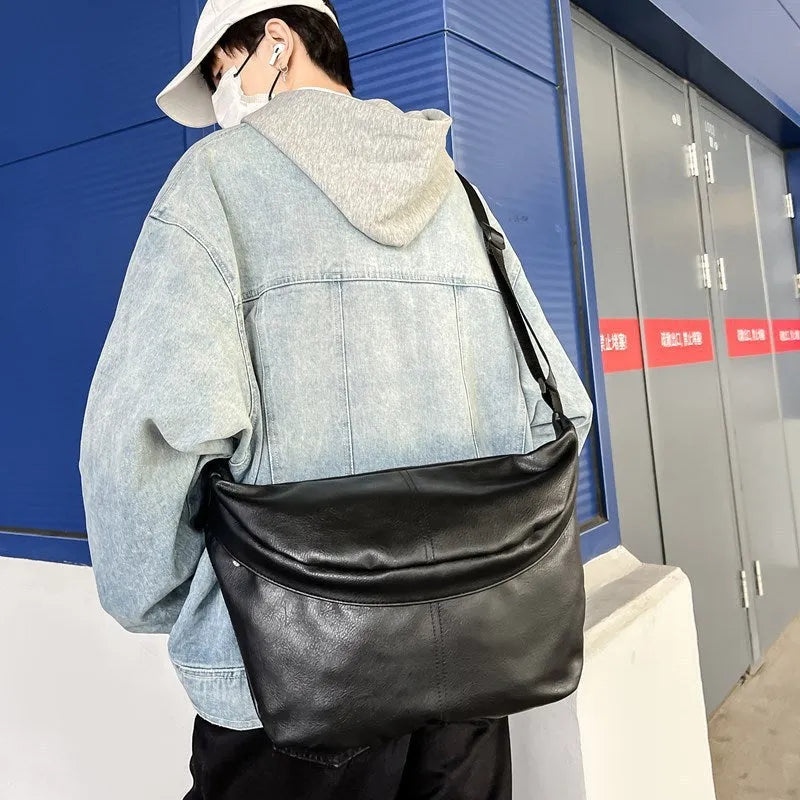 Retro brown men's crossbody bag showing 50cm width and PU construction with adjustable strap