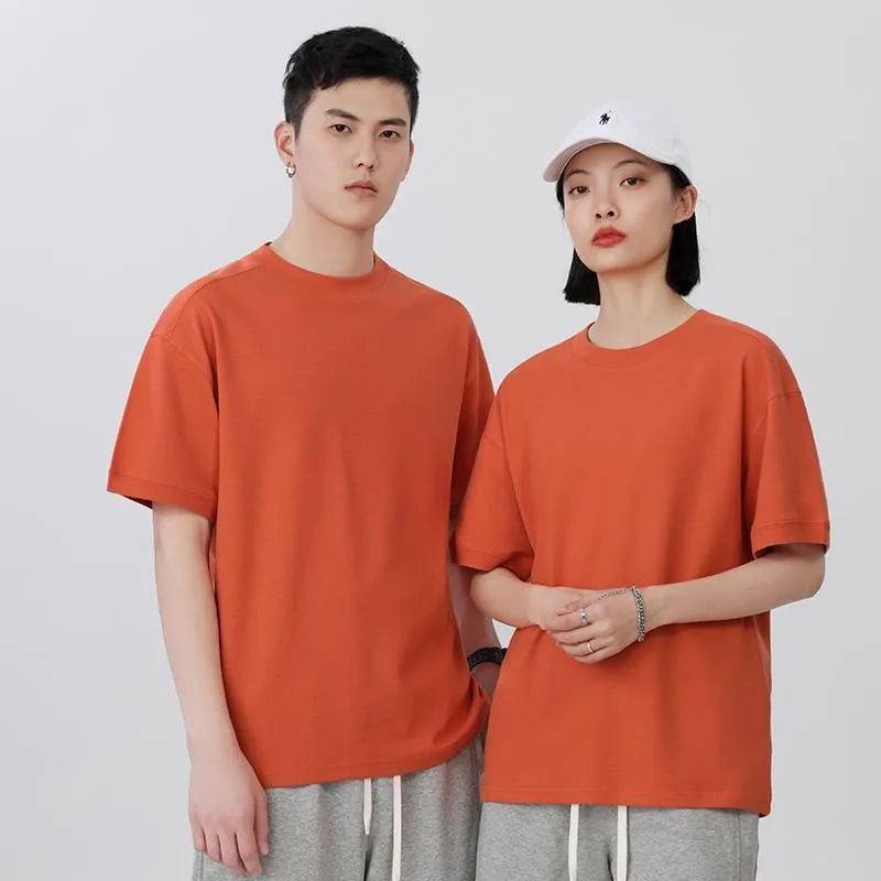 Breathable cotton pique short-sleeved T-shirt in a loose pullover style on a solid colour background.