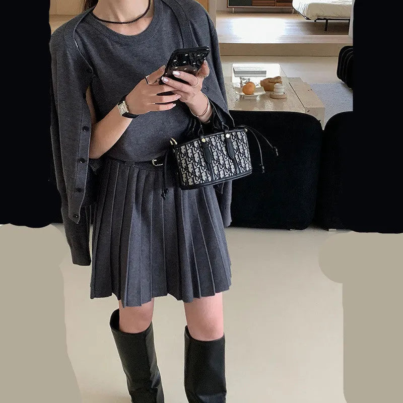 Grey knitted women's two-piece set with vest skirt, long-sleeved cardigan and pleated detail