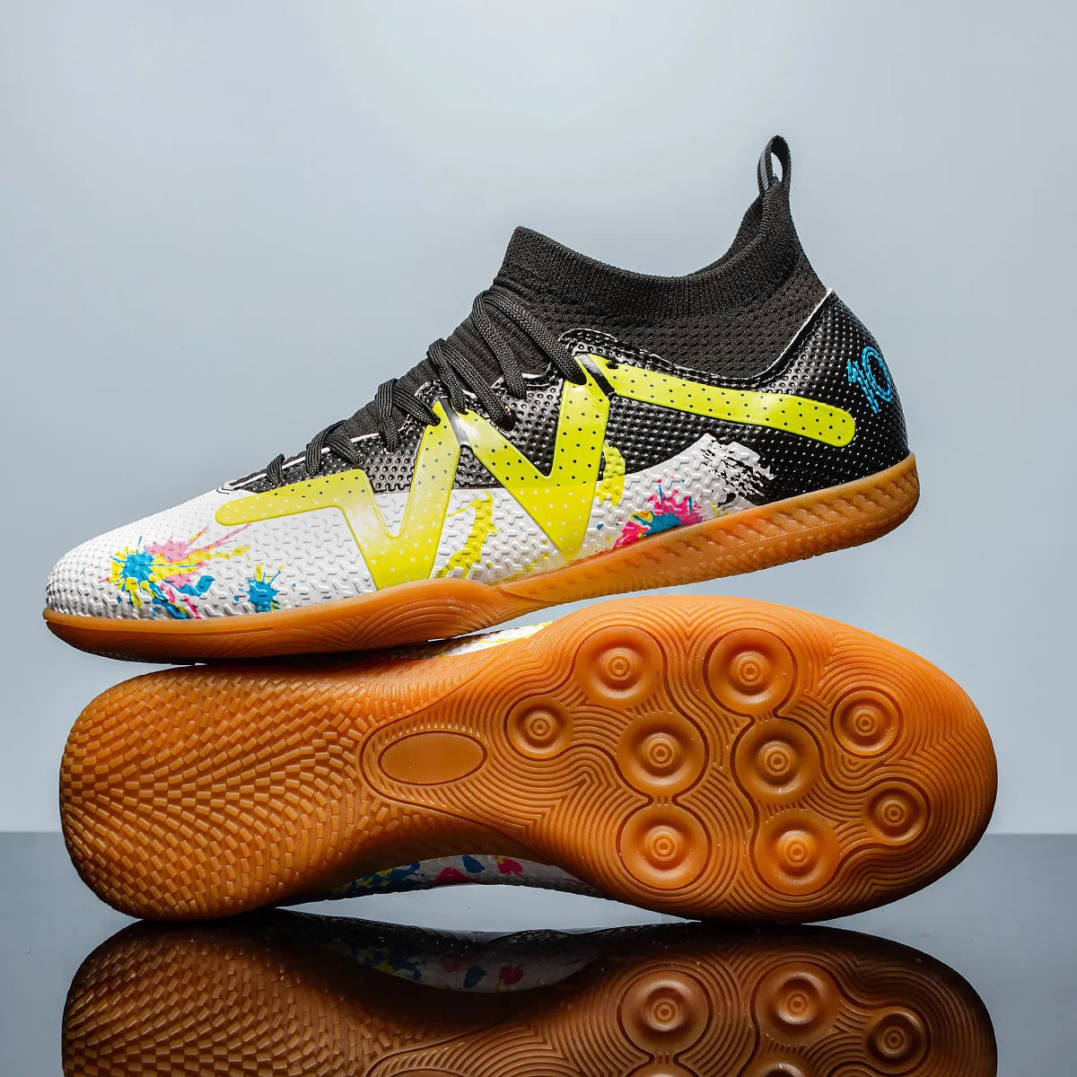 Low-top football boots in black and yellow with a PVC upper and non-slip rubber studded outsole.