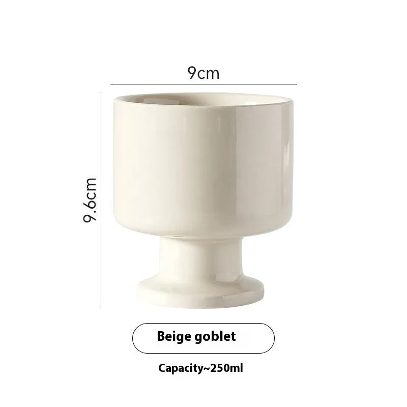 Handmade irregular solid colour ceramic mug on a table