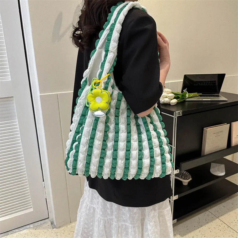 Soft pleated polyester women's crossbody bag in square shape with detachable pendant.