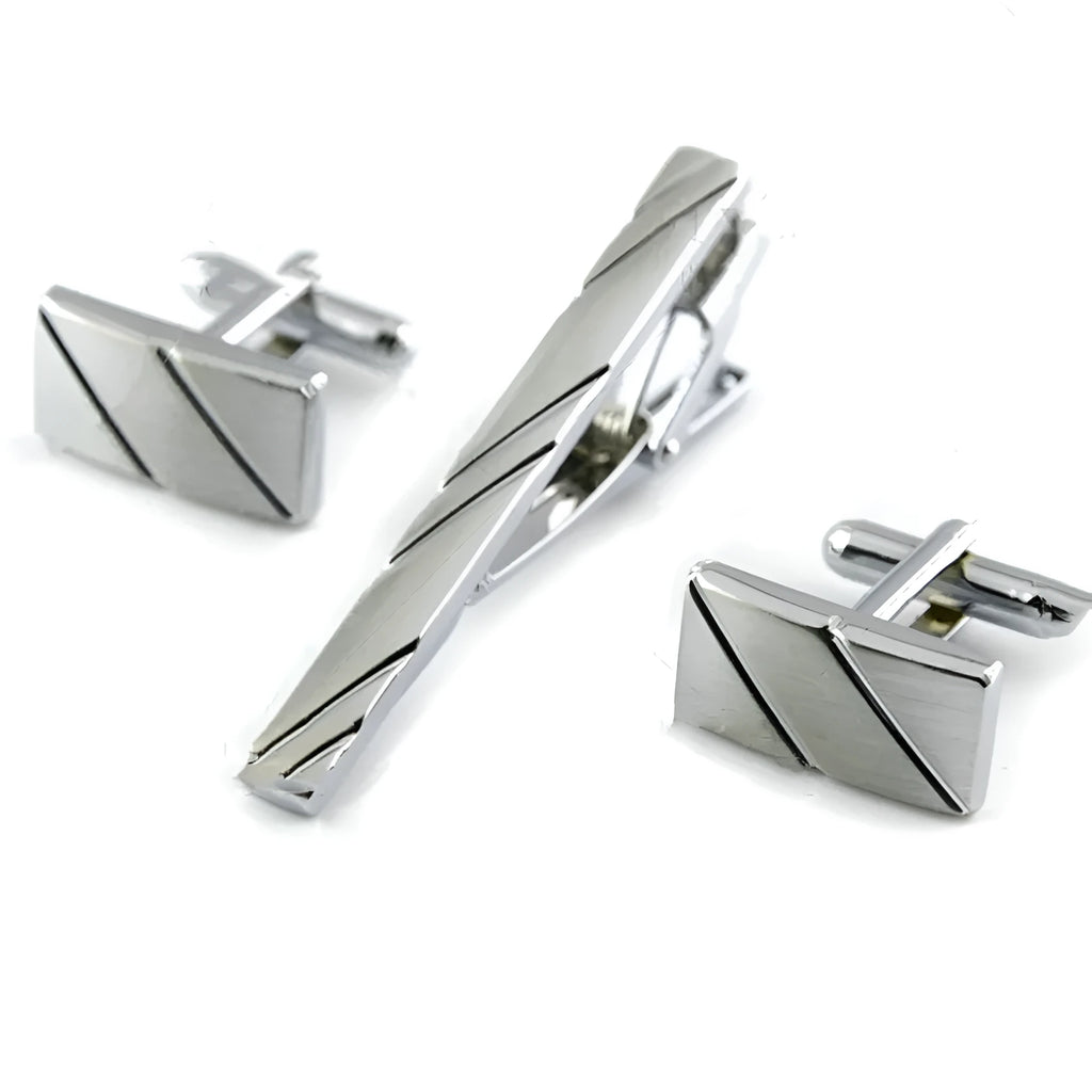 Silver diagonal alloy cufflinks with K9 crystal and matching tie clip on a white background