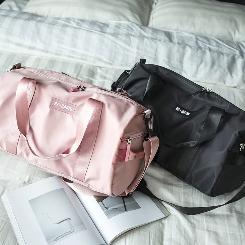 Beige casual sports bag with letter pattern design and contrast colour details.