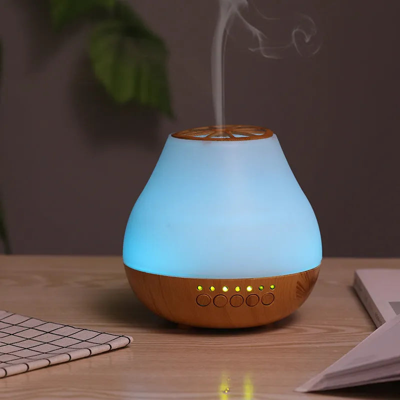 USB-powered ultrasonic essential oil aroma diffuser with wood grain finish and colourful LED lighting effects