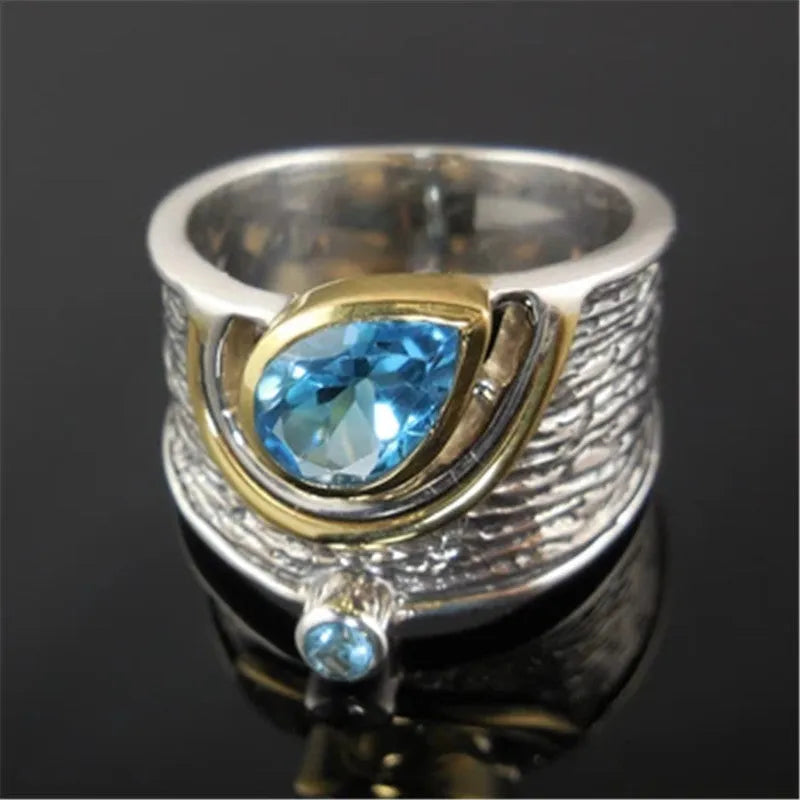 Women's Chinese style drop shape ring with blue rhinestone zircon centrepiece on alloy band