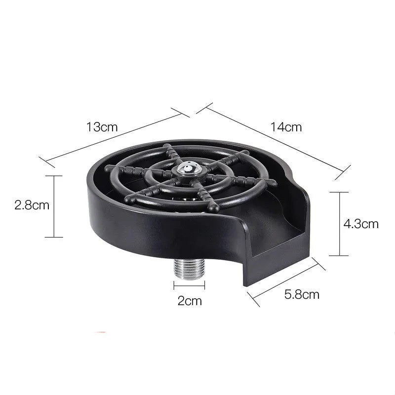 Black automatic cup washer with five-hole nozzle installed on a bar counter sink with a glass being rinsed