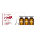Three small bottles of nourishing hair root liquid serum with ginger and rosemary oils
