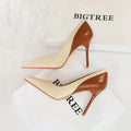 Women's black retro stiletto high heel pumps with pointed toe and super high heel