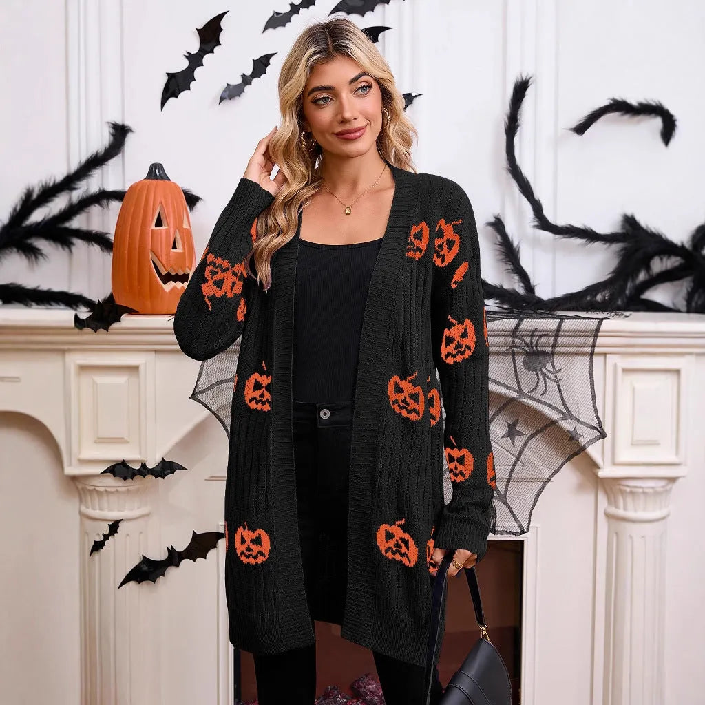 Women's black cardigan with orange pumpkin head jacquard pattern, open front, regular sleeves.