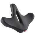 Black thick foam bicycle seat cushion on a mountain bike saddle.