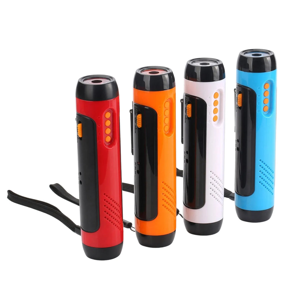Orange emergency FM rechargeable alarm flashlight with hand crank on a dark outdoor background