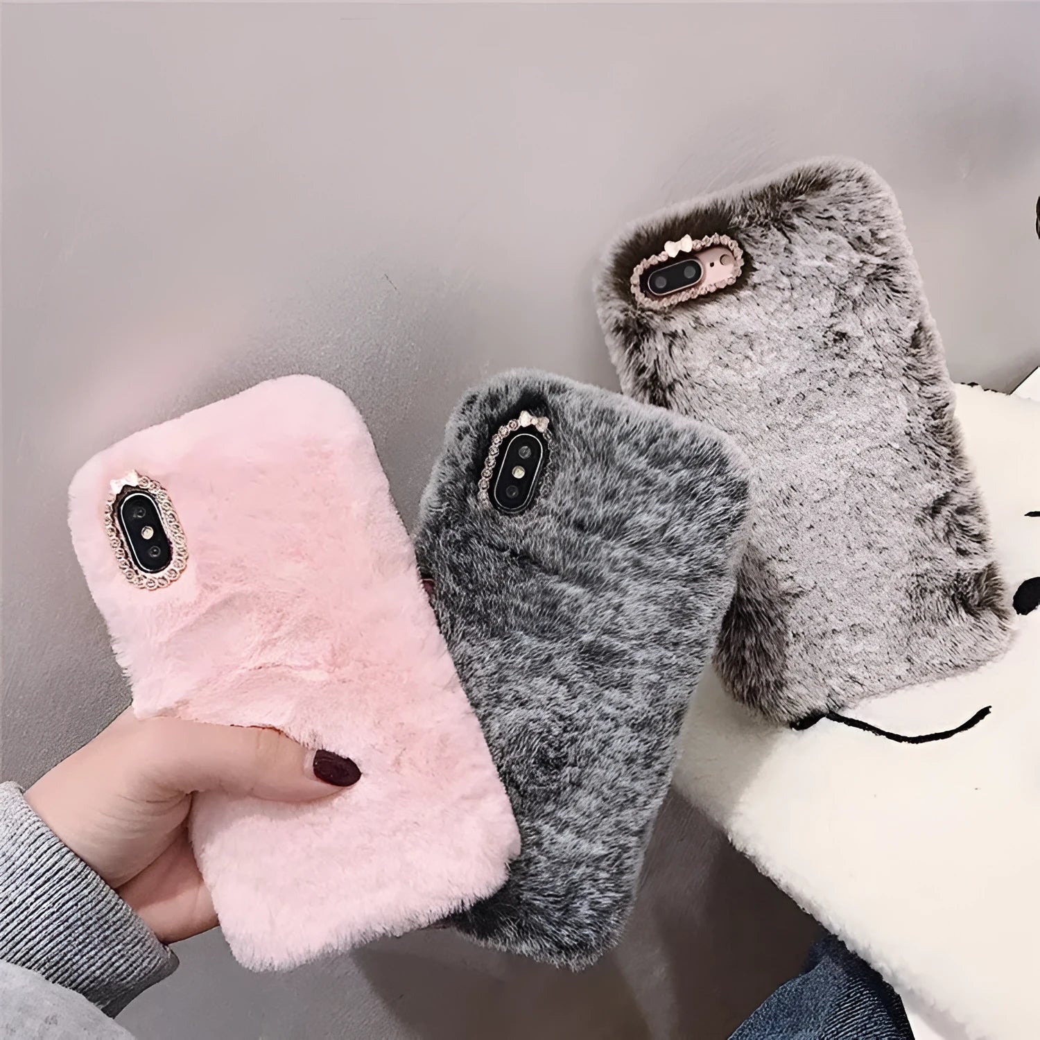Silicone iPhone protective case with rhinestone decoration and a soft plush bottom shell.
