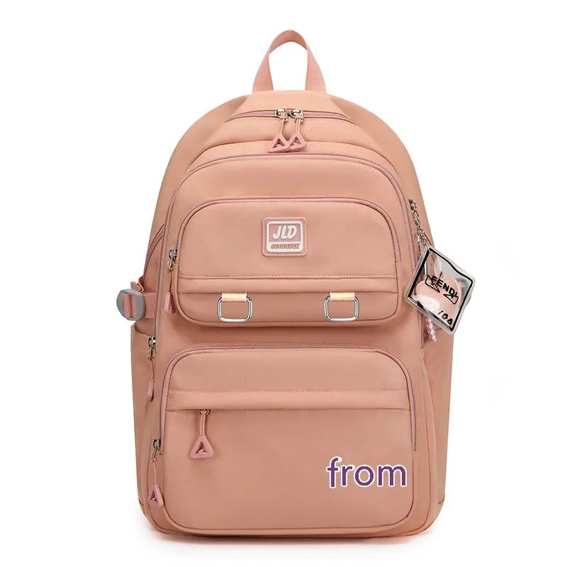 Large capacity nylon school backpack for girls with curved backplate, shown in a colour or print option.