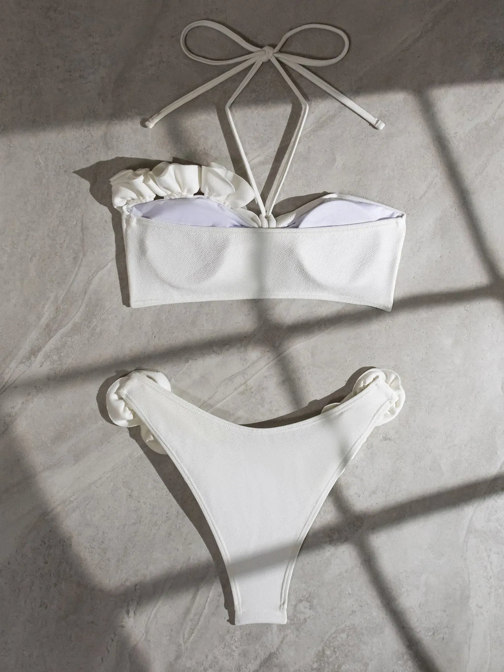 White halter neck lace-up swimsuit bikini set with three-dimensional floral pattern on briefs