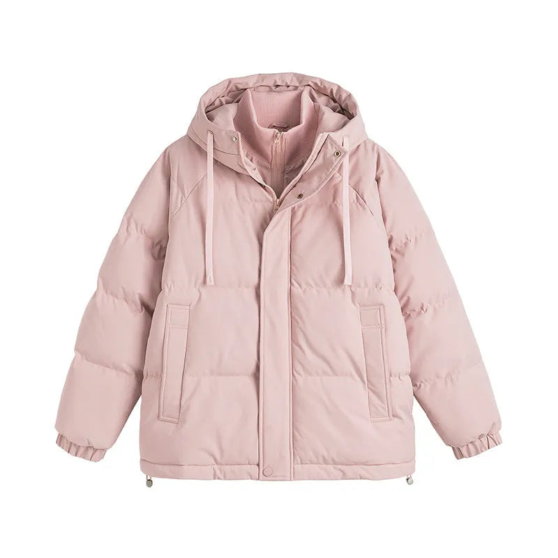 A loose, longline beige cotton-padded winter coat for men and women with side seam pockets.