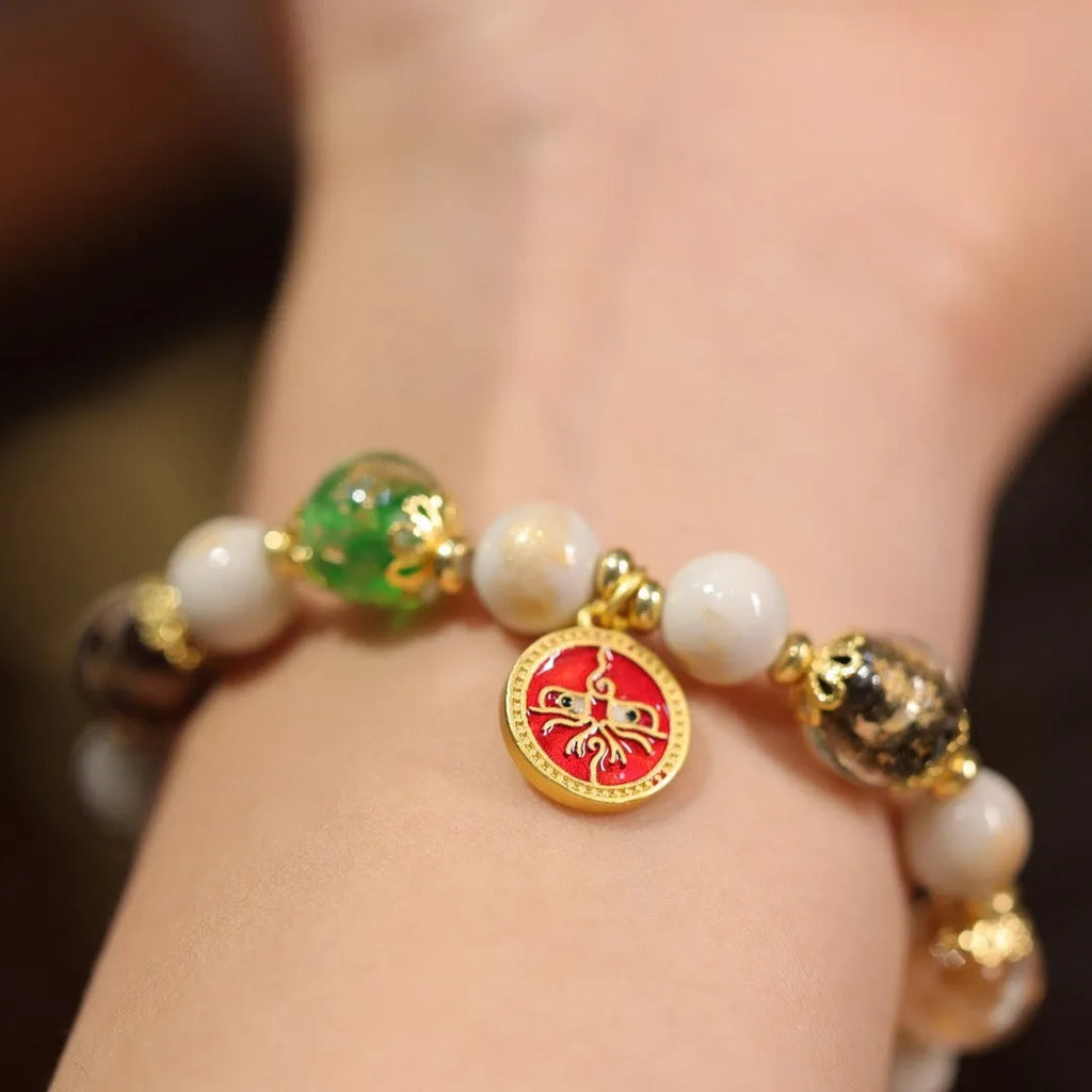 Handmade coloured glaze bracelet with 10mm glass beads showing gods of wealth motifs in national style design