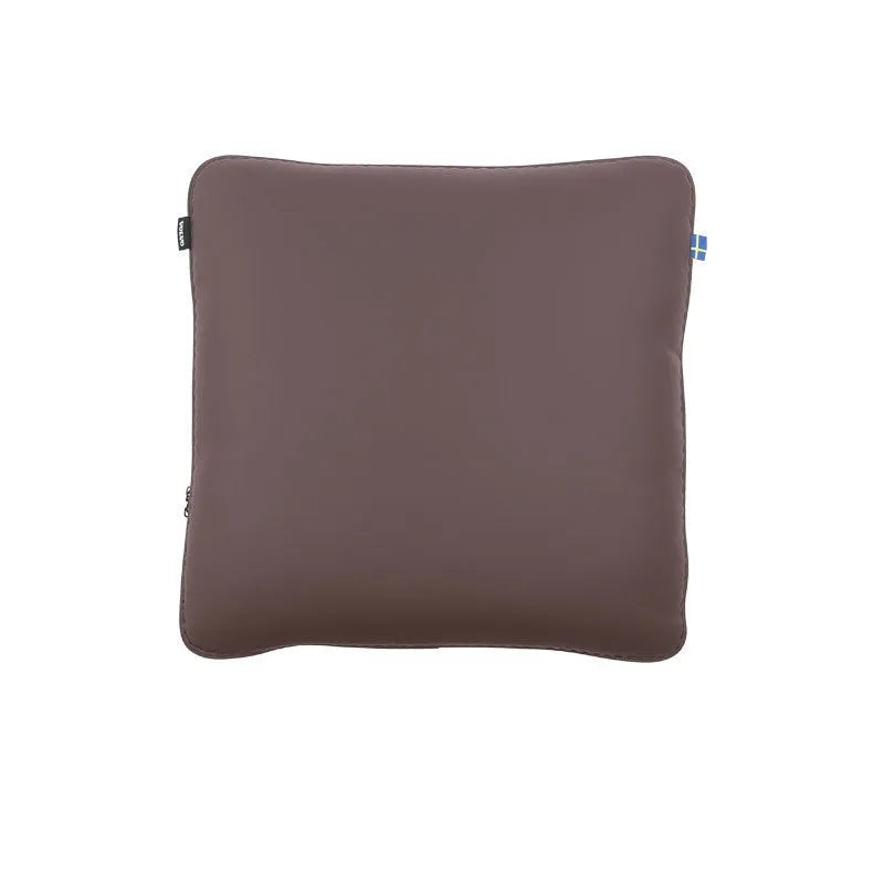 Volvo car headrest, neck pillow, and lumbar support cushion set in a minimalist design on a car seat