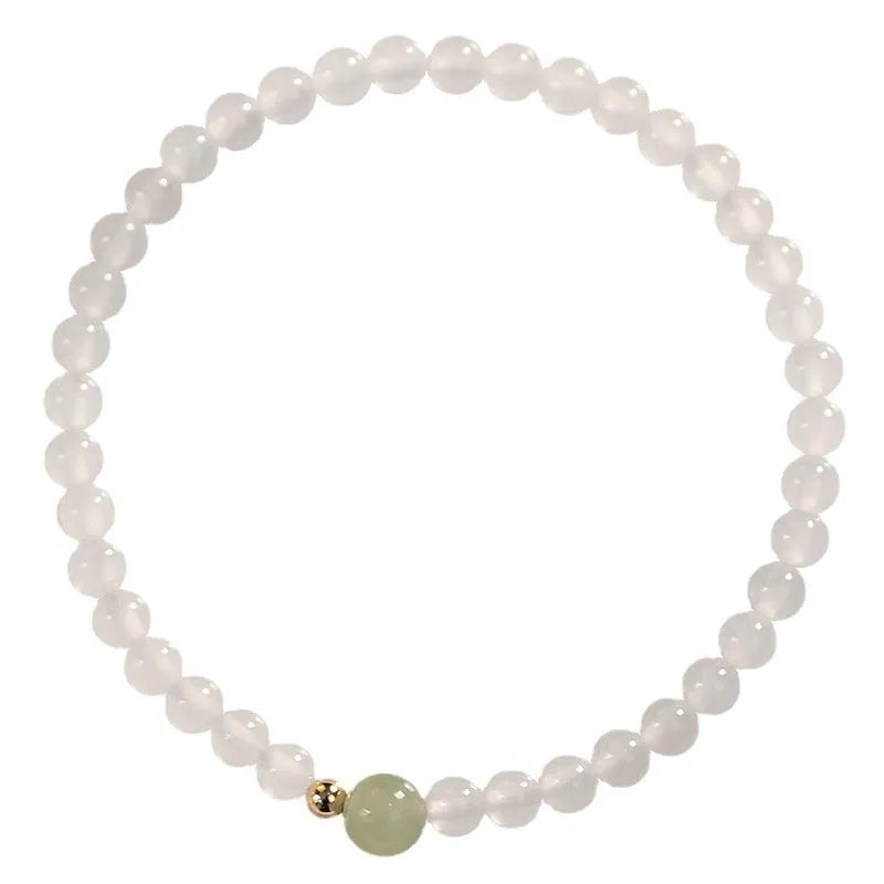 Natural white agate women's bracelet on wrist showing handmade beads and 15cm length.