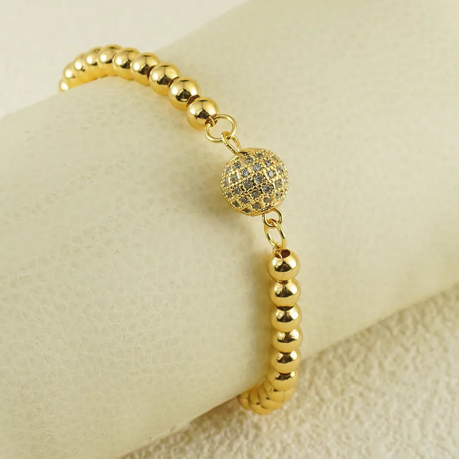 Women's copper bracelet with a heart-shaped design and a single ball zircon detail.