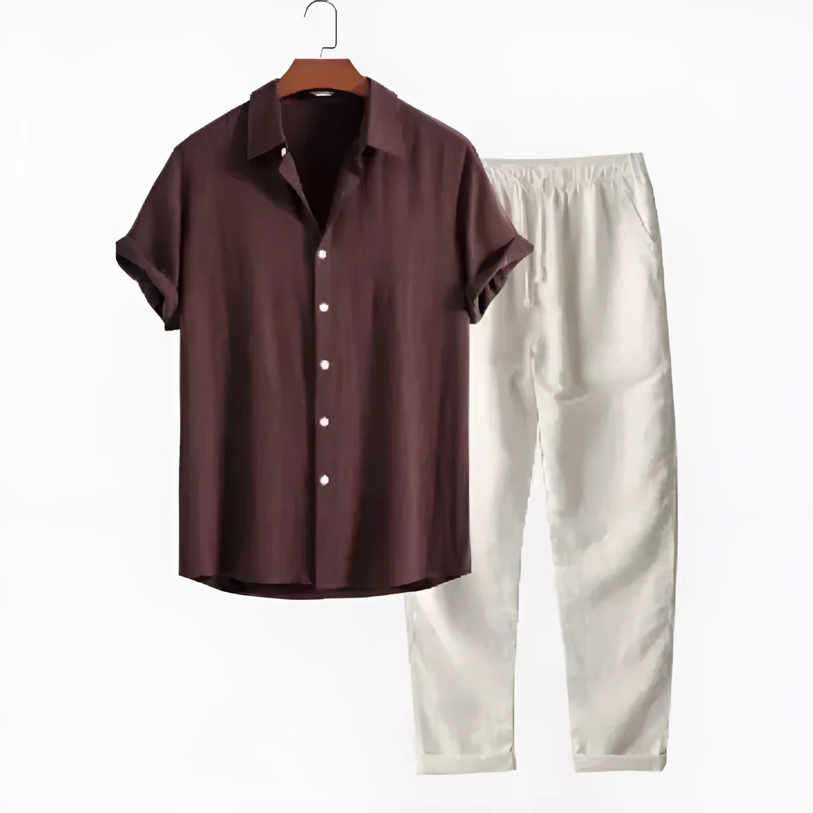 Man wearing a loose fit linen-look short sleeve shirt and matching casual trousers in a neutral colour.