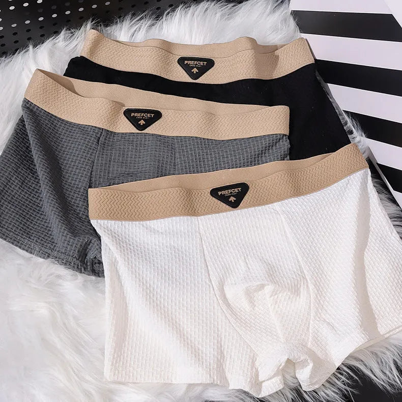 Men's ice silk sport boxer in nylon, mid waist cut, available in multiple colours including black and white