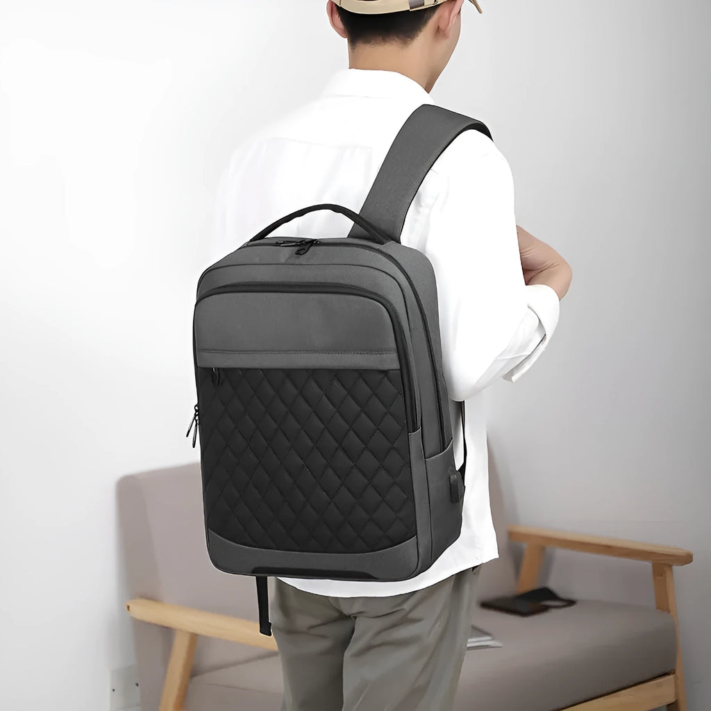 Men's Oxford cloth travel backpack in solid colour with curved shoulder straps and diamond mesh detailing
