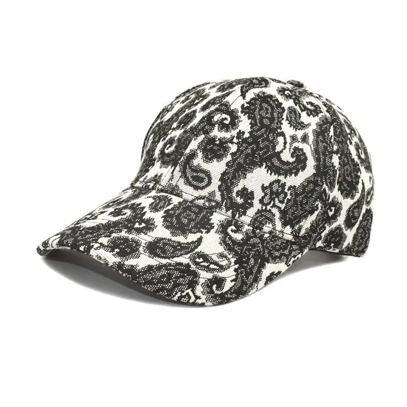 Paisley pattern printed baseball cap in blue with dome crown style on a white background.