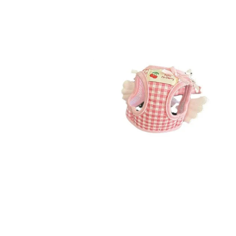 Pink and black cotton chest and back harness with rope leash for a small dog on a white background.