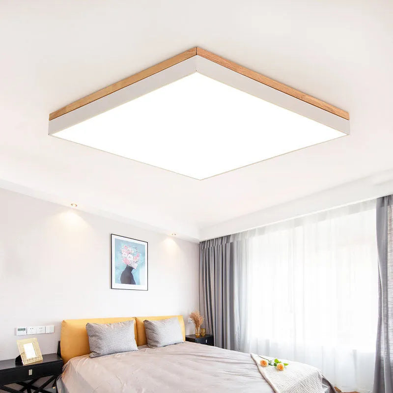 Round Nordic style ceiling lamp with solid wood and iron frame, white acrylic diffuser, shown in a living room setting.