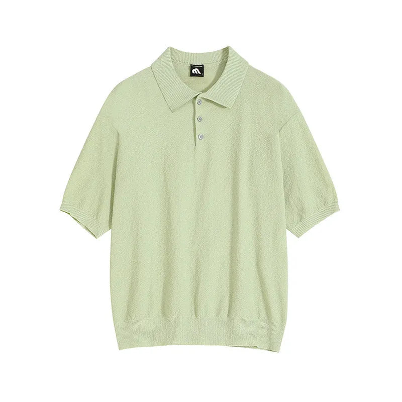 Man modelling a caramel-coloured retro asymmetric knitted polo shirt with short sleeves.