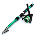 Blue children's fishing rod and reel set with matching tackle box on a grassy bank.