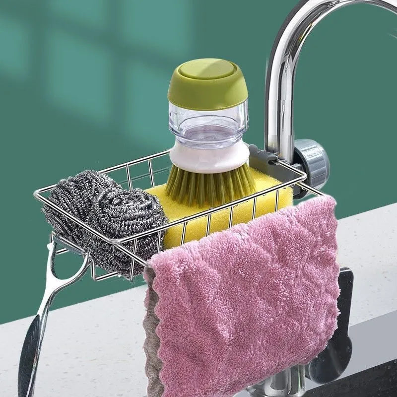 Adjustable stainless steel sink drain rack clipped onto a kitchen faucet with sponge and soap stored on the removable holder