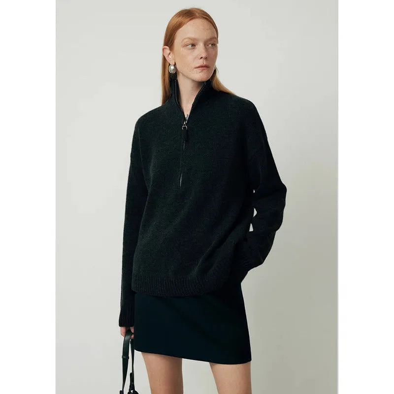 Loose-fit black wool bandage dress with long sleeves on a model.