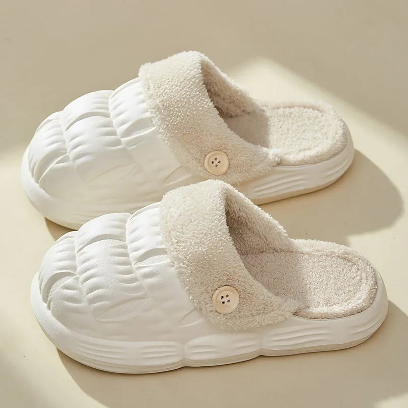 Removable fluffy slippers in beige with faux fur lining and Velcro fastening on a wooden floor
