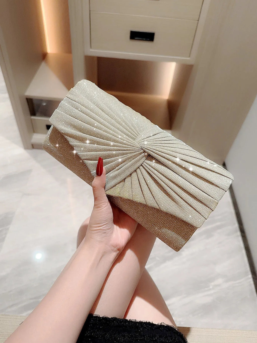 Horizontal square dinner clutch in silver or gold with woven exterior, open pocket, and internal phone bag.