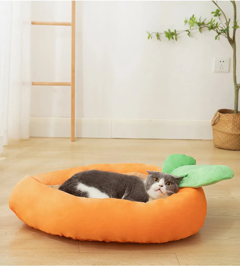 Carrot-shaped plush dog nesting bed with a soft blanket, shown in M and L sizes.