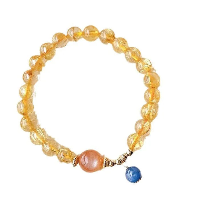 Handcrafted natural gold rutilated quartz sunstone bracelet with diamond-shaped and round crystal beads for women