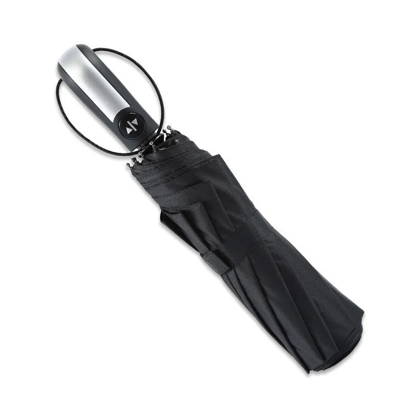 Black triple-fold automatic umbrella with palace-style canopy, shown open to demonstrate 110cm coverage.